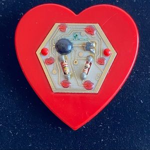 Vintage Solix 1988 plastic robotic heart pin